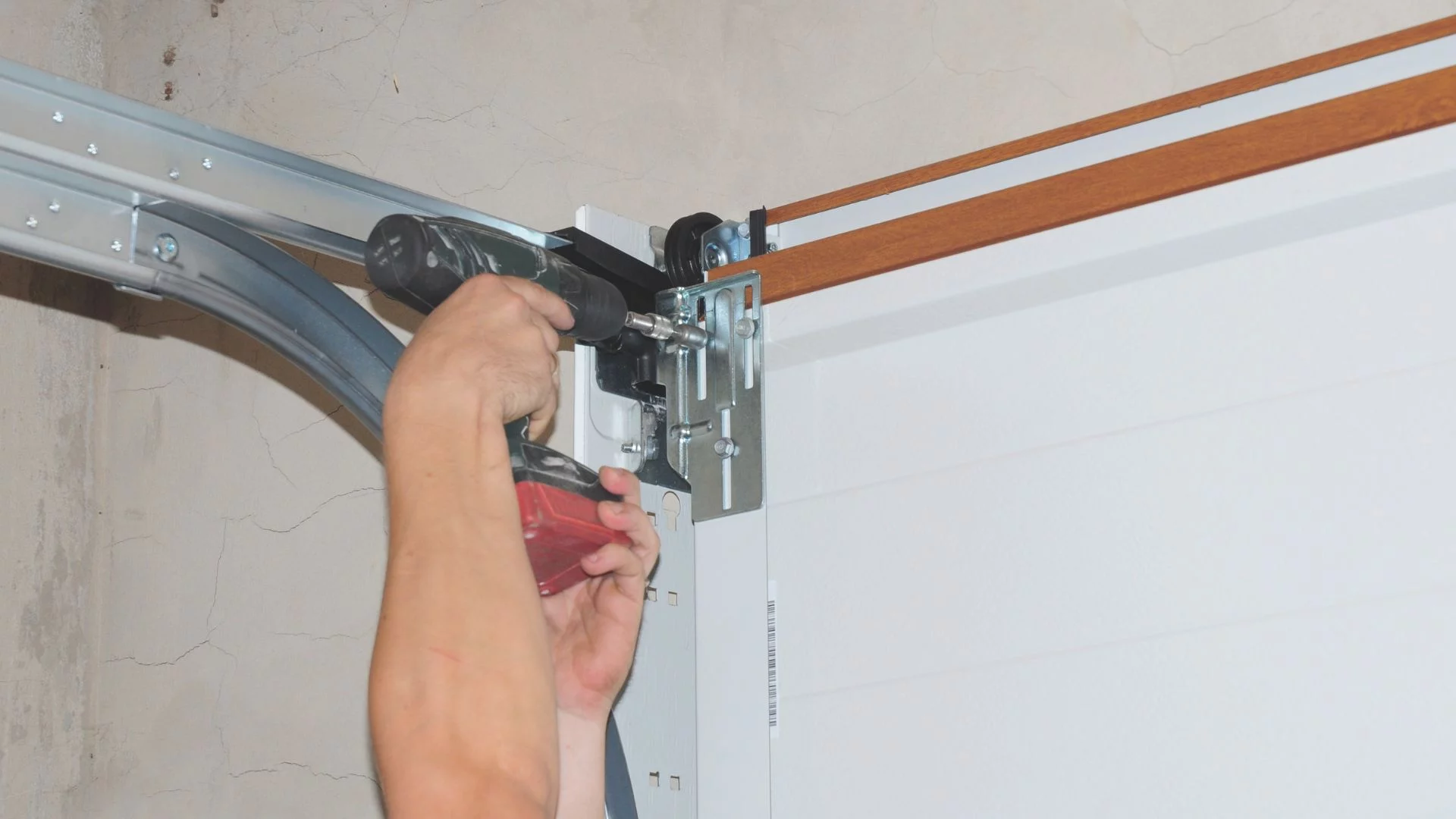 Home garage door track & roller repair